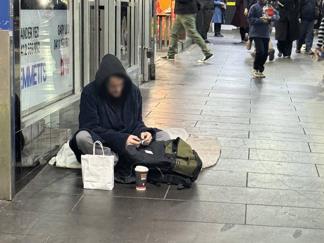 A man settles in for the night on Degraves St. Picture: Supplied