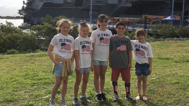 FAMILY WAITING: Quinn, 10, Evan, 8, and Reese, 6, said they couldn’t wait to see their dad Brent Jaquith who is the commander of strike fighter squadron VFA27.