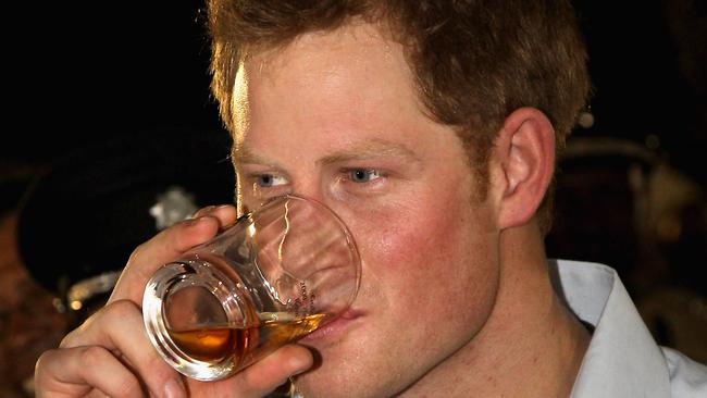 BELIZE CITY, BELIZE - MARCH 02:  Prince Harry enjoys a drink as he attends a Jubilee Block Party on March 2, 2012 in Belmopan, Belize. The Prince is visiting Belize as part of a Diamond Jubilee tour where he will be visiting Belize, the Bahamas, Jamaica and Brazil as a representative of Queen Elizabeth II. Belize is a Commonwealth realm with a population of around 350,000. With the second longest barrier reef in the world and with much of the country covered in tropical jungle with a diversity of wildlife Belize relies heavily on tourism.  (Photo by Chris Jackson-Pool/Getty Images)