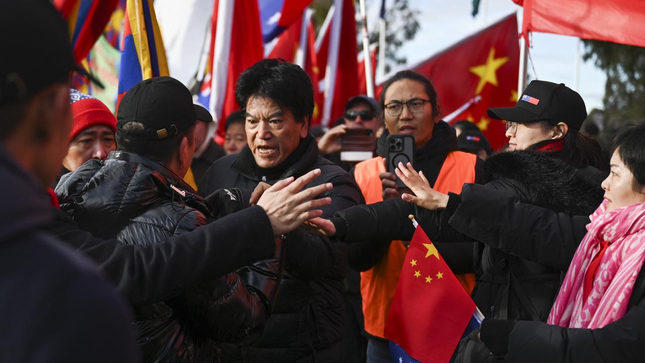 AFP and protestors gather on the laws ahead of the Chinese Premier Li Qiang's visit to Parliament House in Canberra. Picture: NewsWire / Martin Ollman