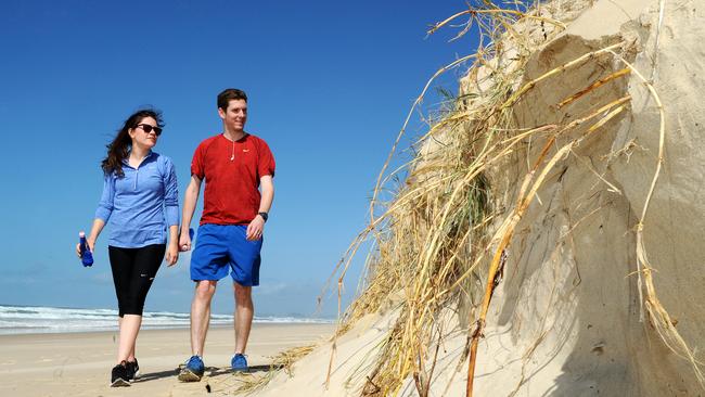 Becky and Daniel Corr from England. Narrow Neck, beach erosion and windy weather. Picture: John Gass