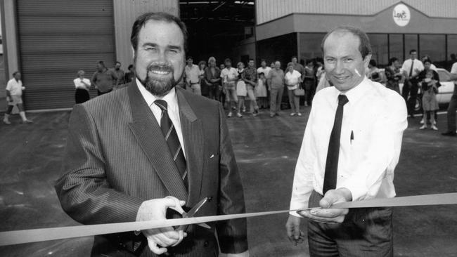 SA politician John Quirke with Loy’s Drinks SA manager Sav De Palma, cutting ribbon at official opening of new Loy’s Drinks premises at Cavan in 1992.