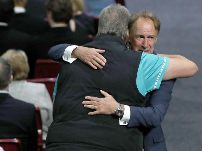 Scott Harris receives a hug from Tasmania JackJumpers head coach, Scott Roth, at Jo Harris’s Celebration of Life service at MyState Bank Arena in April 2023. Picture: Nikki Davis-Jones