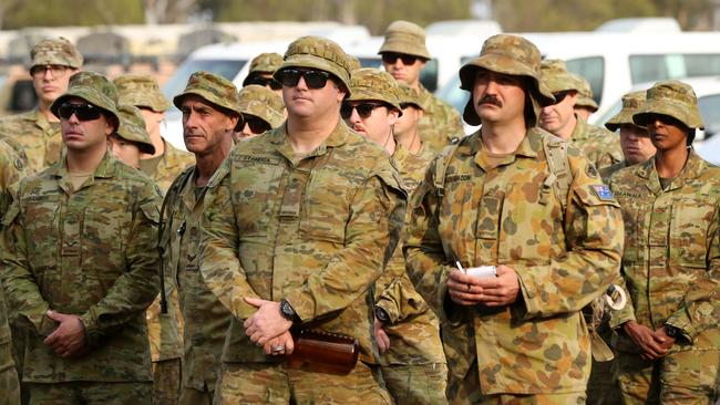 Australian Army Reserve and Regular personnel are seen during a roll call ahead of departing the Holsworthy Barracks to support bushfire efforts across NSW, in Sydney, Sunday, January 5, 2020. Picture: AAP/Danny Casey.