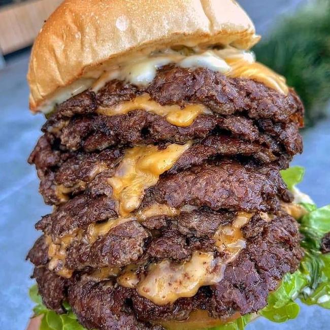 An absolute monster of a burger, this one is a truffle burger special with nine patties and nine slices of cheese. Picture: Wing Fix.