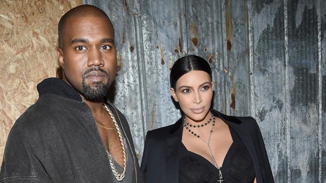 NEW YORK, NY - SEPTEMBER 11: Rapper Kanye West (L) and television personality Kim Kardashian attend the Givenchy fashion show during Spring 2016 New York Fashion Week at Pier 26 at Hudson River Park on September 11, 2015 in New York City. (Photo by Larry Busacca/Getty Images)