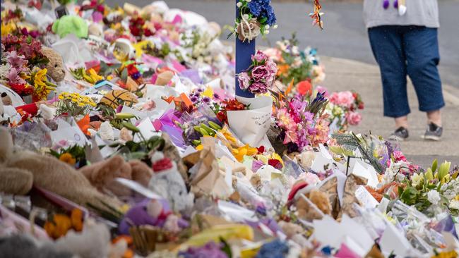 In the aftermath of the accident, mourners carpeted the entrance of Hillcrest Primary School in a tribute to the lost children. Picture: Jason Edwards