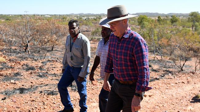 Former Prime Minister Malcolm Turnbull visits the Battery Hill mining museum with tradition owner Ronald Plummer (left), at Tennant Creek, in the Northern Territory, Monday, July 23, 2018. Malcolm Turnbull's visit to the region marks the first Prime Ministerial visit since Malcolm Fraser in 1982, and is in response to child protection concerns in the town. (AAP Image/Dan Himbrechts) NO ARCHIVING