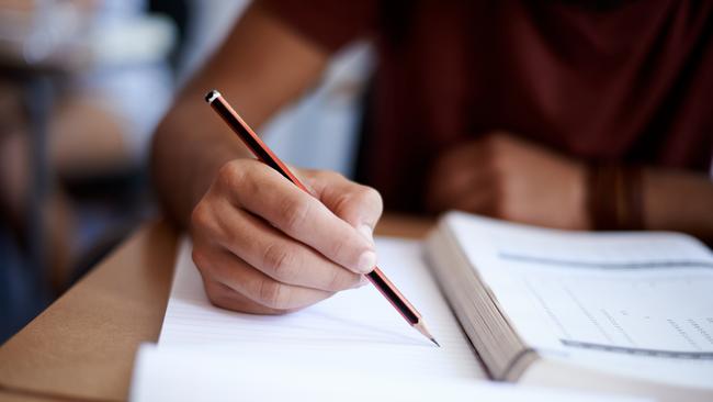 Close up of hands of a student during an exam. Picture: istock