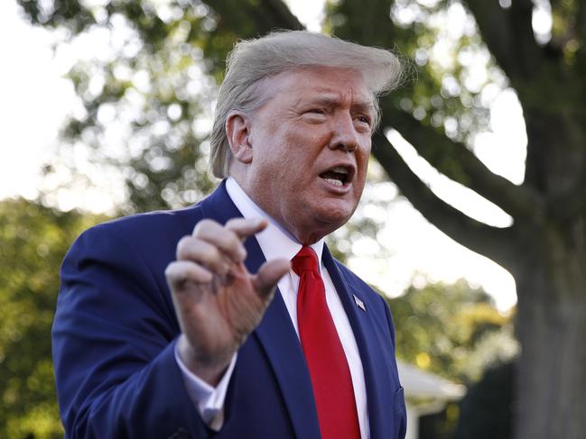 President Donald Trump speaks to members of the media on the South Lawn of the White House in Washington, Thursday, Oct. 10, 2019, before boarding Marine One for a short trip to Andrews Air Force Base, Md., and then on to Minneapolis, for a campaign rally. (AP Photo/Patrick Semansky)