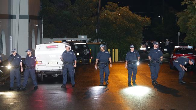 Police comb the area looking for clues after the shooting in Pyrmont.