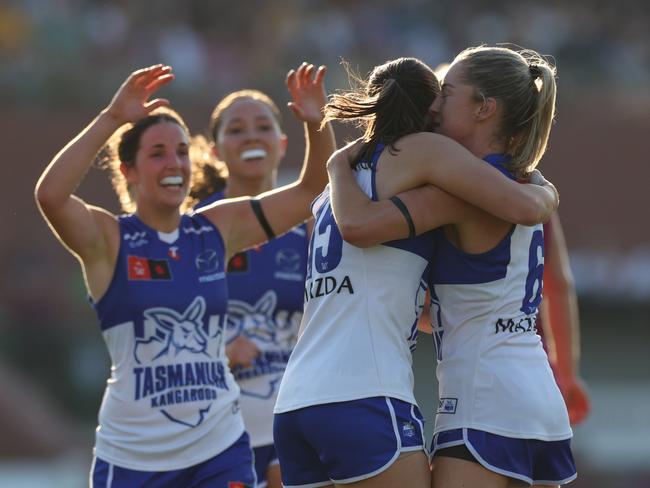 BRISBANE, AUSTRALIA – SEPTEMBER 01: Alice O'Loughlin and Amy Smith of the Kangaroos celebrate a goal during the round one AFLW match between Brisbane Lions and North Melbourne Kangaroos at Brighton Homes Arena, on September 01, 2024, in Brisbane, Australia. (Photo by Mackenzie Sweetnam/Getty Images)