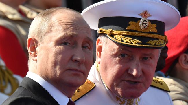 Russian President Vladimir Putin, accompanied by Commander-in-Chief of the Russian navy, Admiral Nikolai Yevmenov. Picture: AFP