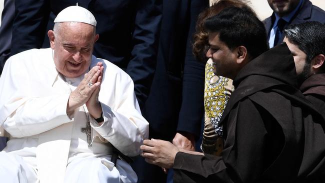 Pope Francis greets people in St Peter's square. Picture: AFP.