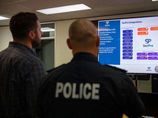 Minister Brent Potter and Acting Commander John Atkin looks at the SerPro, a modern, proven and integrated digital policing system in the NT. Picture: Pema Tamang Pakhrin