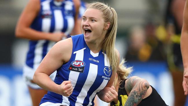 MELBOURNE, AUSTRALIA – MARCH 05: Daria Bannister of the Kangaroos celebrates after scoring a goal during the round six AFLW match between the Richmond Tigers and the North Melbourne Kangaroos at The Swinburne Centre on March 05, 2021 in Melbourne, Australia. (Photo by Robert Cianflone/Getty Images)