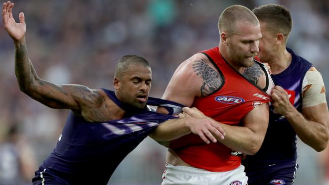 Essendon’s Jake Stringer has a scuffle with Freo opponent Bradley Hill. Picture: AAP