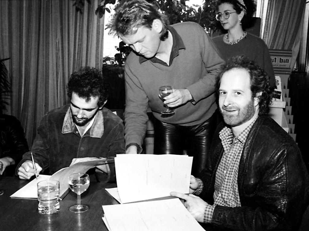 Gudinski with musician Paul Kelly, left, as Kelly re-signs with Mushroom Records. Picture: Ian Greene