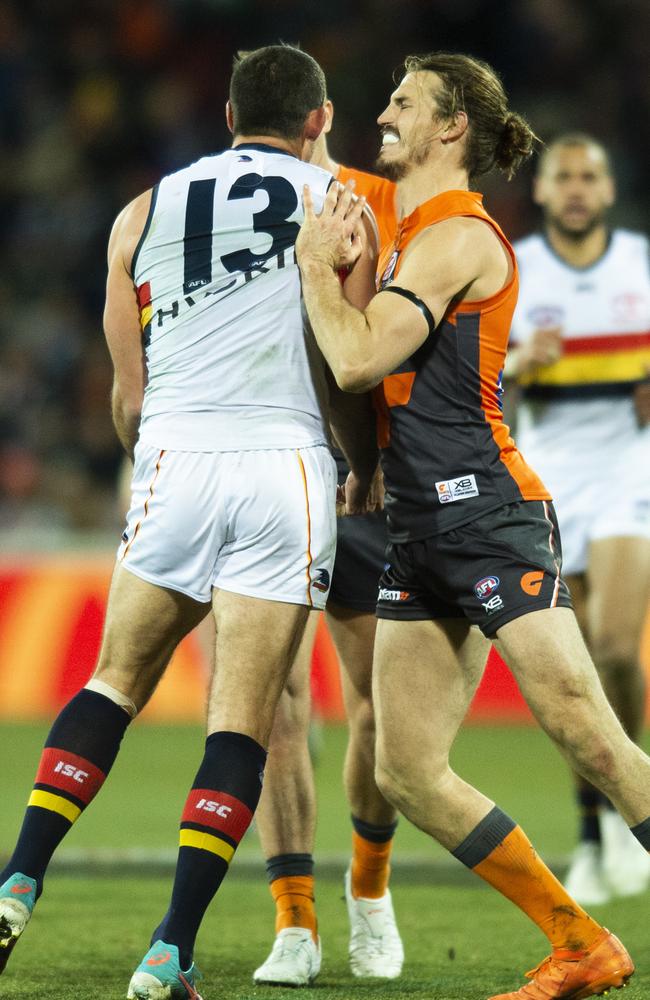 Phil Davis of the Giants pushes Taylor Walker of the Crows after a heavy tackle on GWS onballer Josh Kelly. Picture: AAP Image/Rohan Thomson