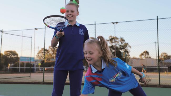 Charlotte Stevens (9) and Maggie Stevens (6) put their tennis skills to the test (Photo: Zilla Gordon).