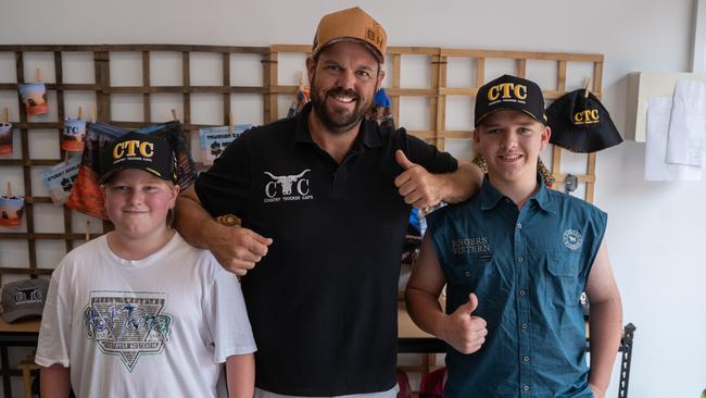 Brett "Knuckles" Hanly with Vincent and Luke Gordon who drove all the way up from Tassie to buy a hat from the store in Mary St, Gympie. Picture: Christine Schindler