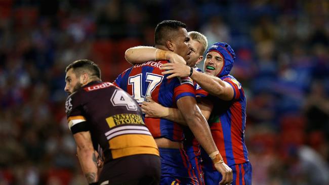 NEWCASTLE, AUSTRALIA — APRIL 07: Daniel Saifiti of the Knights celebrates his try with team mates during the round five NRL match between the Newcastle Knights and the Brisbane Broncos at McDonald Jones Stadium on April 7, 2018 in Newcastle, Australia. (Photo by Ashley Feder/Getty Images)