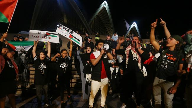 SYDNEY, AUSTRALIA - OCTOBER 09: Palestine supporters rally outside the Sydney Opera House on October 09, 2023 in Sydney, Australia. The Palestinian militant group Hamas launched a surprise attack on Israel from Gaza by land, sea, and air, over the weekend, killing over 600 people and wounding more than 2000, agency reports said. Reports also said Israeli soldiers and civilians have been kidnapped by Hamas and taken into Gaza. The attack prompted a declaration of war by Israeli Prime Minister Benjamin Netanyahu, and ongoing retaliatory strikes by Israel on Gaza killing hundreds in the aftermath. (Photo by Lisa Maree Williams/Getty Images)