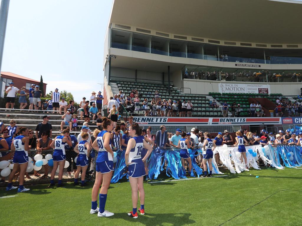 North Melbourne players celebrate with fans after this first win against Carlton. Picture: LUKE BOWDEN