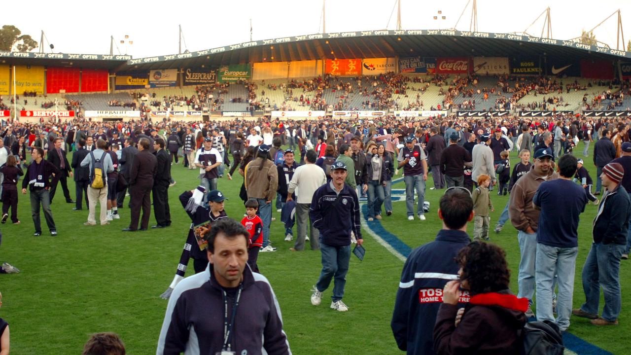 Carlton fans gather on the field at Princes Park after the final AFL game between the Blues and Melbourne in round 9, 2005. Picture: Joe Castro / AAP