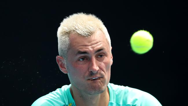 Bernard Tomic in action during his match against Roman Safiullin of Russia during day two of 2022 Australian Open Qualifying at Melbourne Park this year. He is trying to grind his way back up the rankings from the low 300s. (Photo by Graham Denholm/Getty Images)