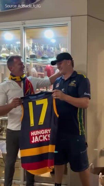 Scott Welsh presents number 17 jumper to son Tyler