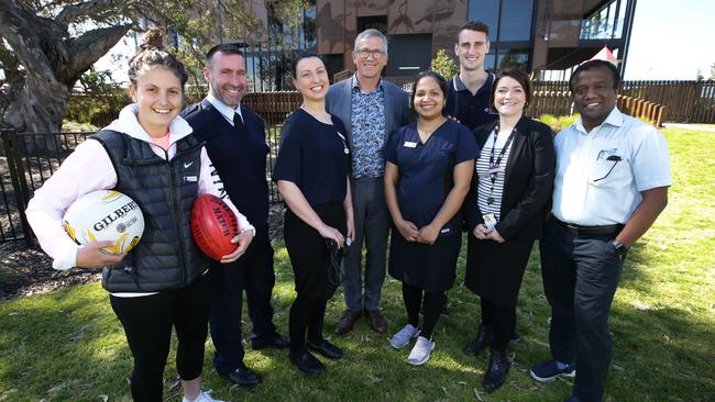 Villawood Properties executive director Rory Costelloe, centre, said the care workers program had helped people from all sorts of roles build a home. Picture: Peter Ristevski