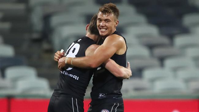 Carlton captain Patrick Cripps hugs Sam Walsh after last week’s win against Geelong. Picture: AAP