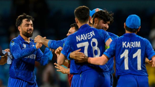 Rashid Khan (left) celebrates with his team. Picture: Randy Brooks/AFP