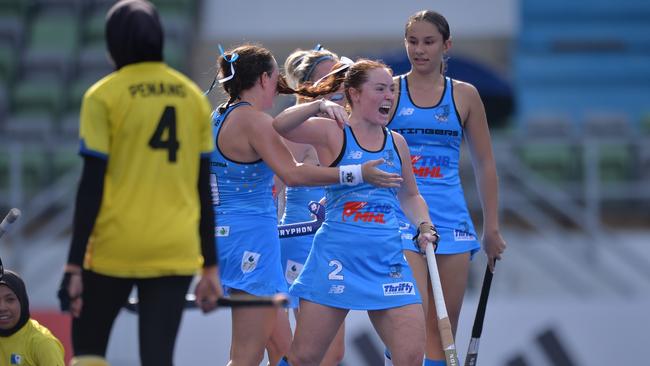 Territory Stingers player Elle Richardson celebrating with teammates after scoring. Picture: Hockey NT / Territory Stingers