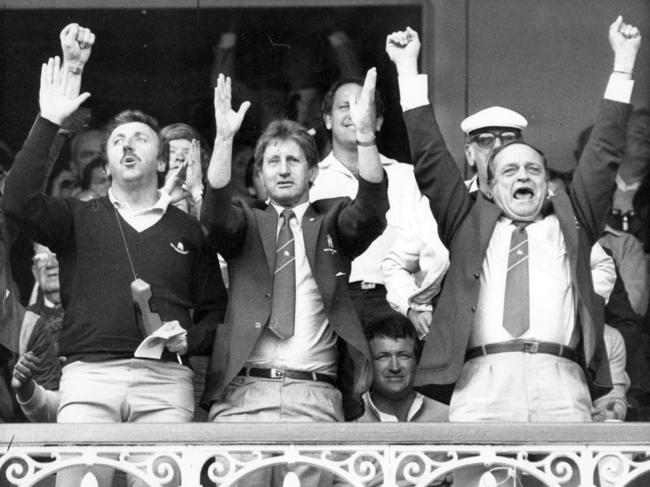 Warren Ryan (L) with assistant Malcolm Clift and Secretary Peter Moore celebrate victory in the 1984 Grand Final. Picture: Graeme Fletcher