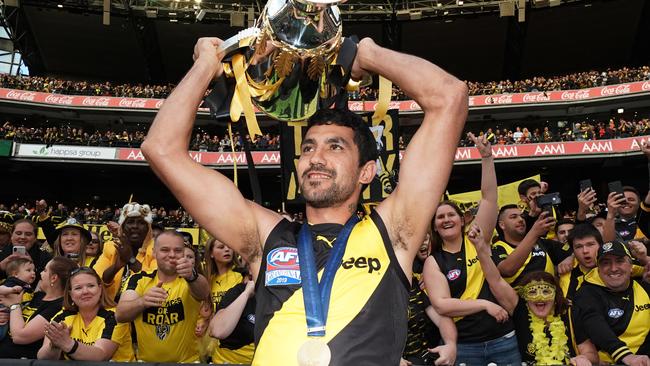 Marlion Pickett of the Tigers celebrates the win with the Premiership Cup during the 2019 AFL Grand Final between the Richmond Tigers and the GWS Giants at the MCG in Melbourne, Saturday, September 28, 2019. (AAP Image/Michael Dodge) NO ARCHIVING