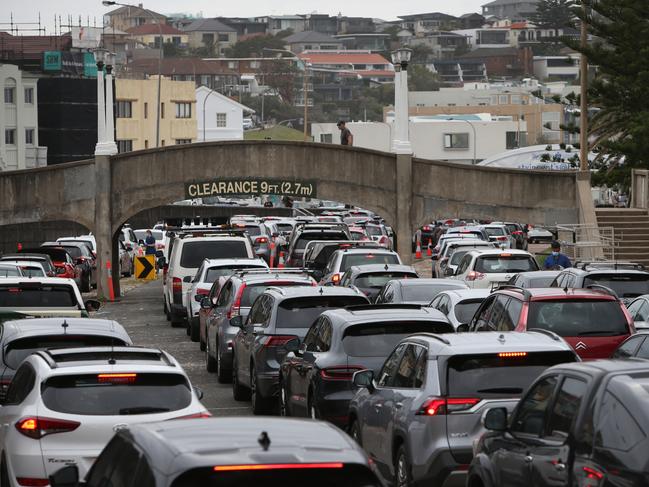 Cars queue at the Bondi Beach Covid-19 testing site. Picture: Getty Images