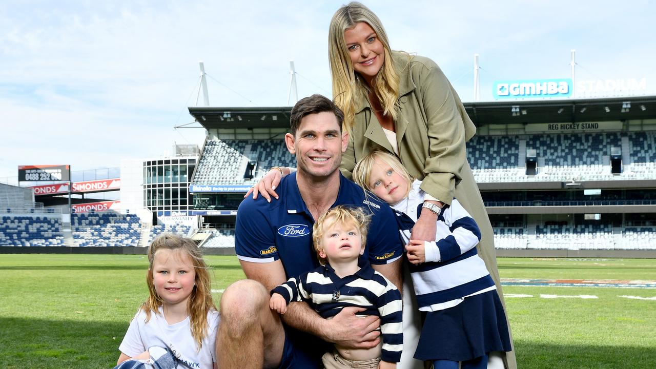 Tom Hawkins poses with his family after retiring. (Photo by Josh Chadwick/Getty Images)