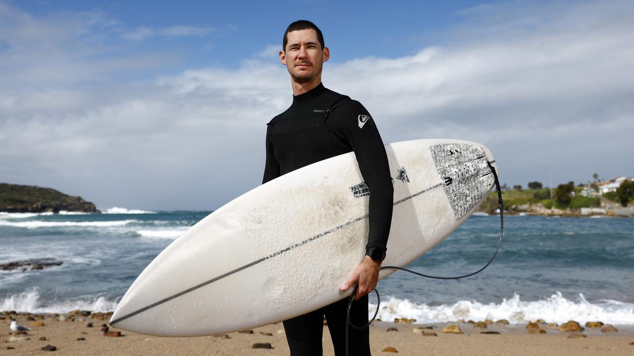 Surfer Brad Chalmer at Malabar Beach believes it’s time for the nets to come down. Picture: Jonathan Ng