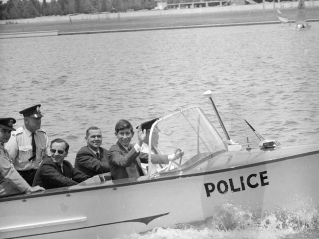 1966: Prince Charles smiles as he takes a ride in a police boat during his first visit to Australia. The teenager enjoyed a break from his studies at Timbertop, the rural campus of Victoria’s Geelong Grammar School, which he attended for two terms. File picture