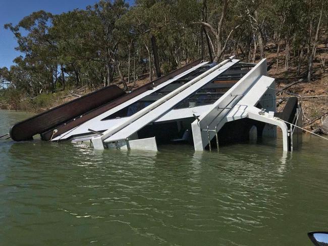 An overturned houseboat at Lake Eildon. Picture: Supplied