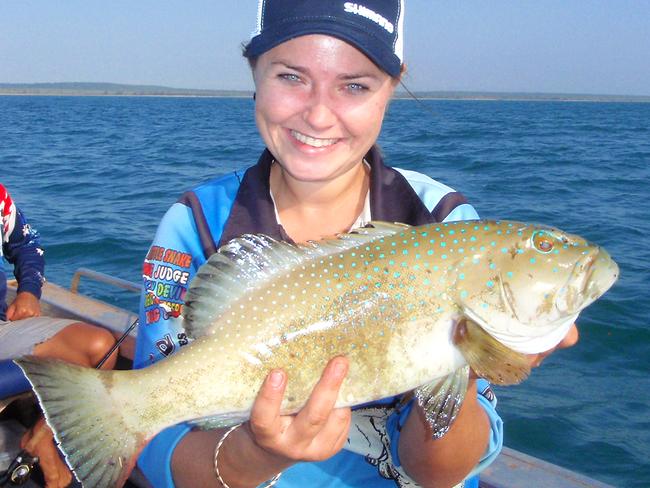 Paige Watteau poses with a fair chunk of coral trout from the Cobourg trip.