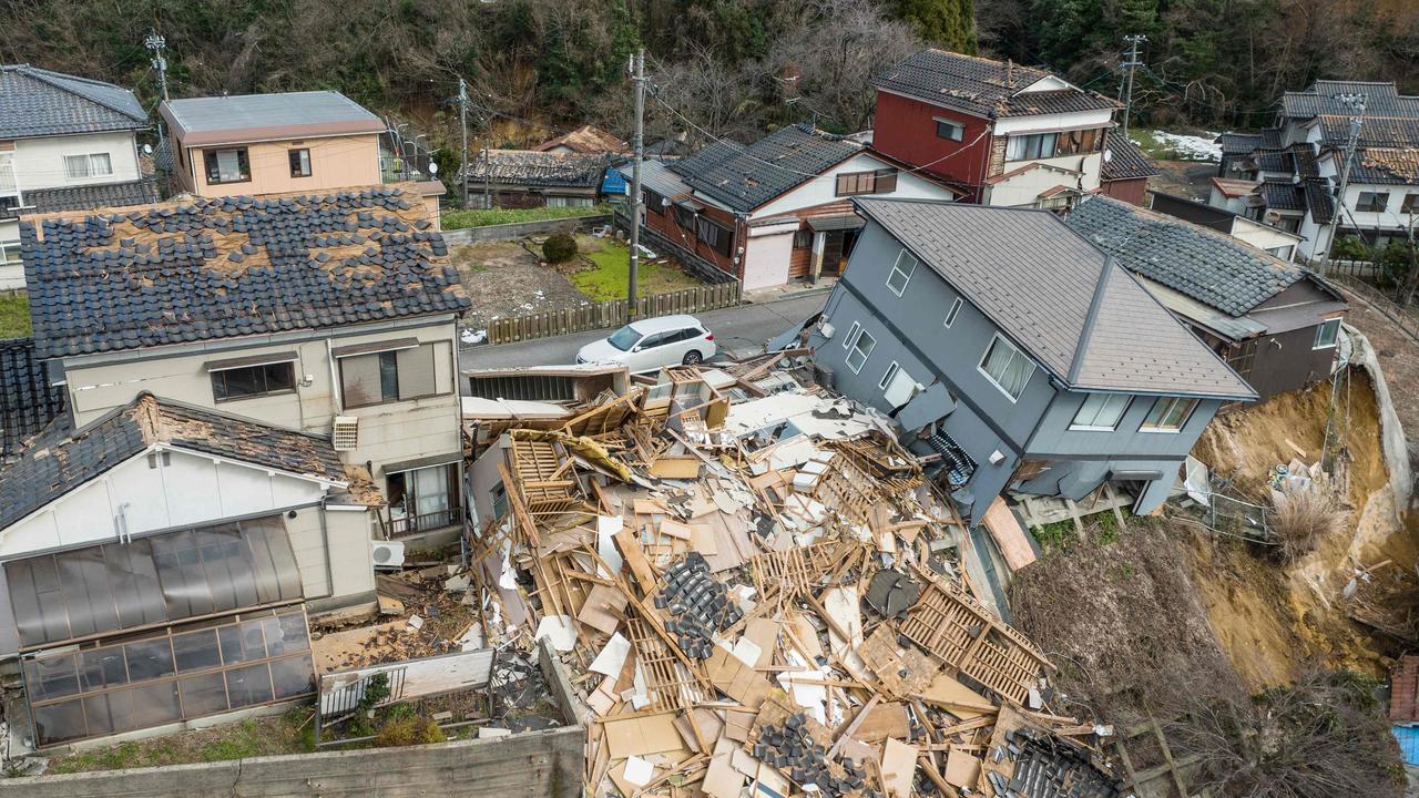 Damaged and destroyed homes along a street in Wajima, Ishikawa. (Photo by Fred MERY / AFP)