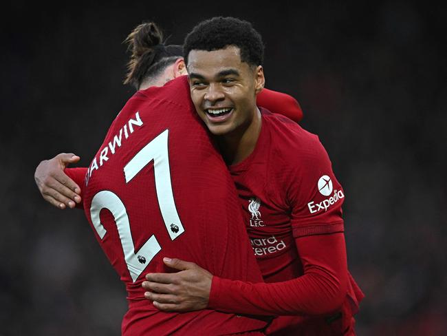 TOPSHOT - Liverpool's Dutch striker Cody Gakpo (R) celebrates with Liverpool's Uruguayan striker Darwin Nunez (L) after scoring the opening goal of the English Premier League football match between Liverpool and Manchester United at Anfield in Liverpool, north west England on March 5, 2023. (Photo by Paul ELLIS / AFP) / RESTRICTED TO EDITORIAL USE. No use with unauthorized audio, video, data, fixture lists, club/league logos or 'live' services. Online in-match use limited to 120 images. An additional 40 images may be used in extra time. No video emulation. Social media in-match use limited to 120 images. An additional 40 images may be used in extra time. No use in betting publications, games or single club/league/player publications. /