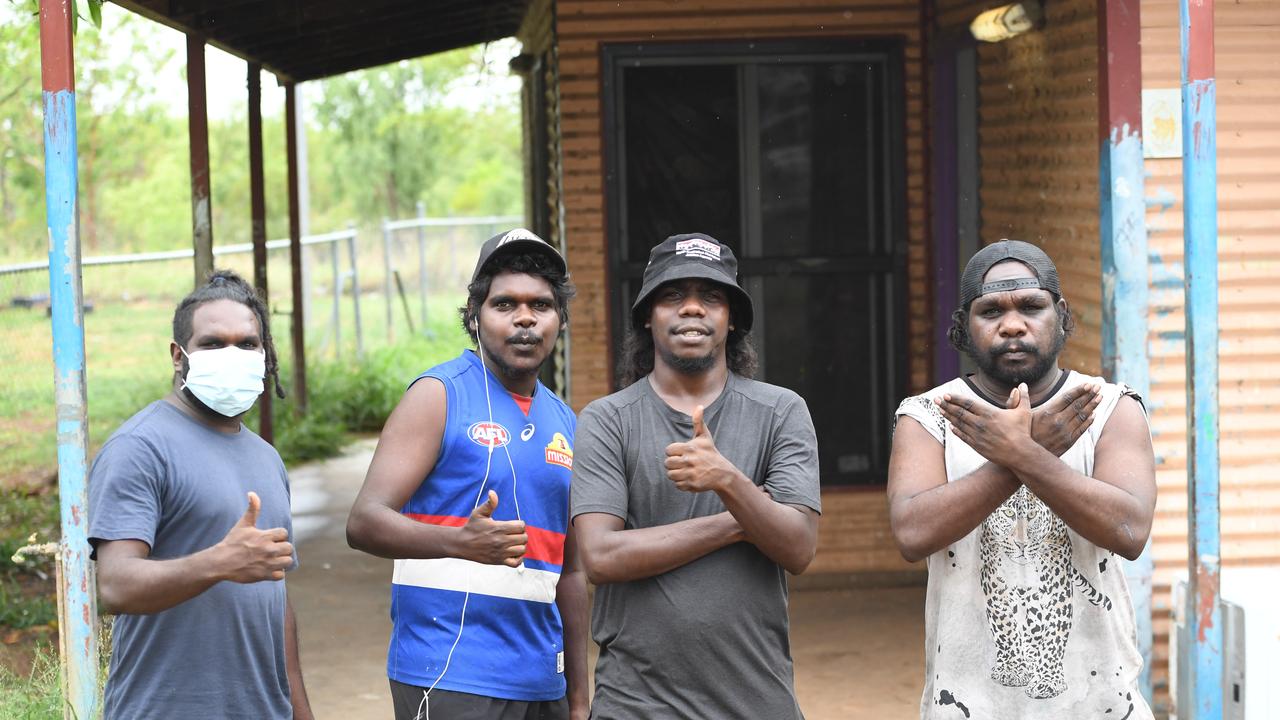 Rockhole residents Keithon, Mathais, Brian and Timothy outside after a week long hard lockdown. Picture: Amanda Parkinson