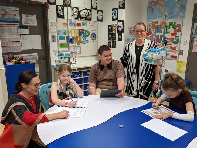 Teacher Alison Schubert, pupils Zara, Alexander and Selina and teacher aide Meaghan Millership at the school classroom in Gold Coast University Hospital. Picture: Keith Woods.