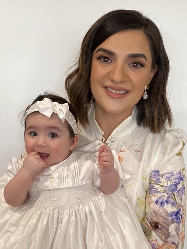 Werribee mum Francine Buhagiar with daughter Elise on her baptism day.