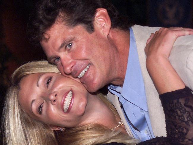 ** FILE ** Pamela Bach, left, poses with husband David Hasselhoff in this Aug. 11, 2000 file photo in Los Angeles.  Less than a month after filing for divorce, Bach, the estranged wife of Hasselhoff, is alleging that the former "Baywatch" star abused her, according to court records. (AP Photo/Jill Connelly, File)