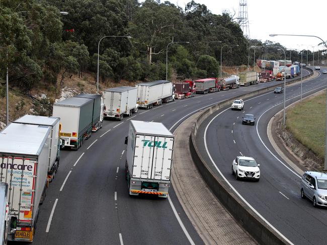 The huge line of trucks waiting to get past the rollover at Crafers. Picture: Kelly Barnes / AAP